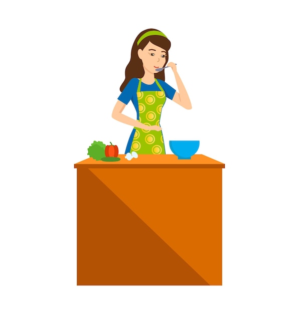 キッチンの主婦の女の子は、食べ物のあるテーブルで食べ物を試します