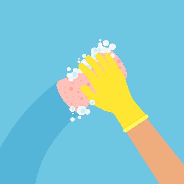 家事労働者が表面を拭きます 保護ゴム製の黄色の手袋をはめたスポンジで手を掃除します