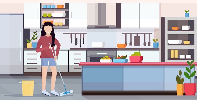 Huisvrouw dweilen vloer vrouw schoner doen huishoudelijk werk meisje holding mop schoonmaak concept moderne keuken interieur volledige lengte vlak en horizontaal