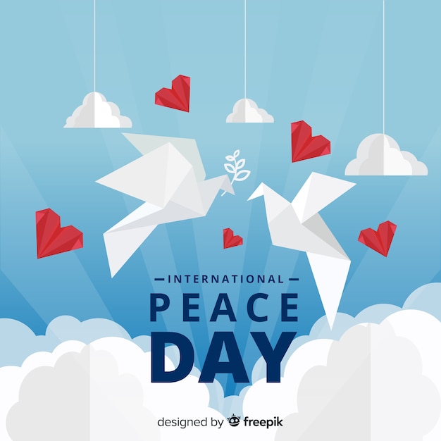 종이 접기 스타일의 흰색 비둘기와 국제 평화의 날 개념
