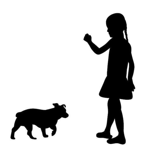 犬と遊ぶ子供の分離された黒いシルエット