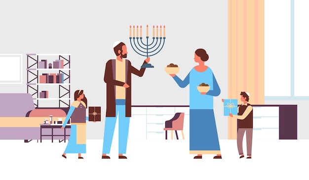 Jews family holding menorah and gift boxes jewish parents children in traditional clothes standing together happy hanukkah judaism religious holidays