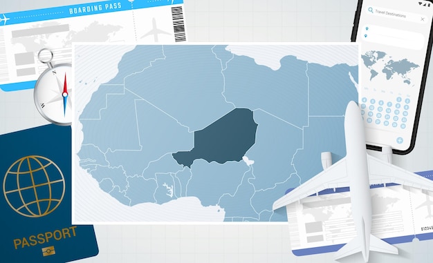 飛行機携帯電話パスポート コンパスとチケットとニジェールの背景の地図とニジェールの図への旅