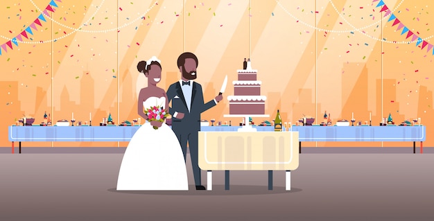 Just married man woman cutting sweet cake romantic   couple bride groom in love wedding day concept modern restaurant interior full length horizontal flat