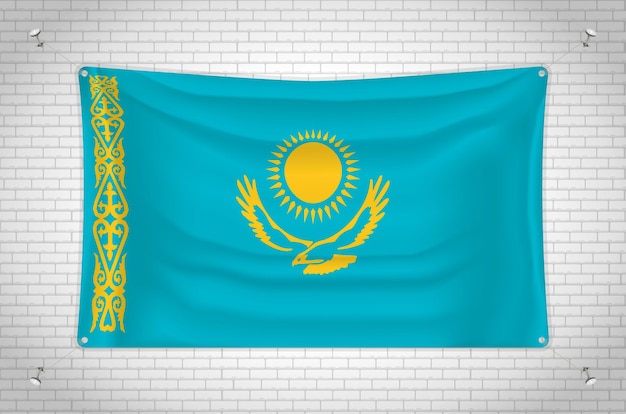 レンガの壁に掛かっているカザフスタンの旗。 3D 描画。壁に取り付けられた旗。
