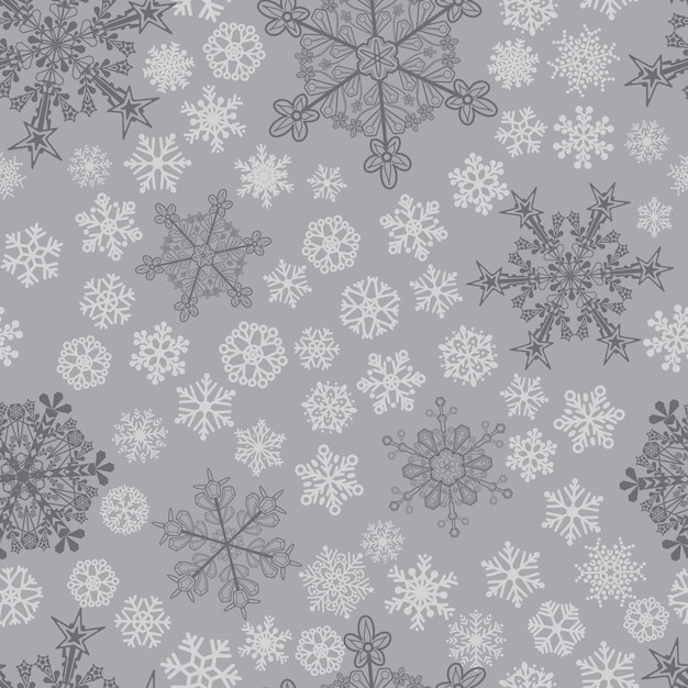 Kerst naadloos patroon van grote en kleine sneeuwvlokken grijs op grijs