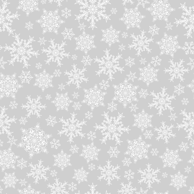 Kerst naadloos patroon van grote en kleine sneeuwvlokken, wit op grijs