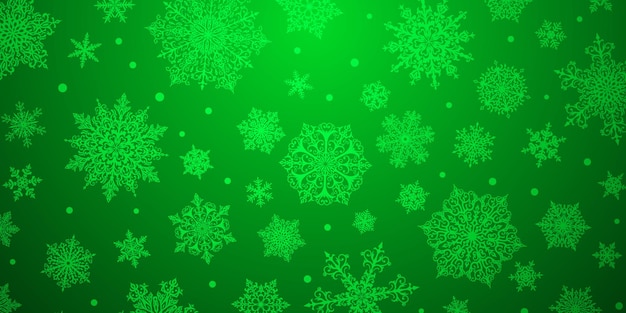 Kerstachtergrond van grote en kleine complexe sneeuwvlokken in groene kleuren