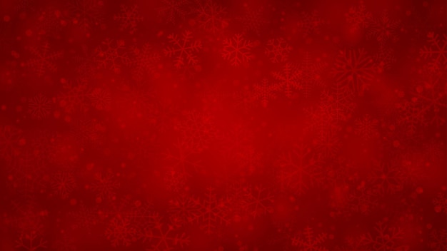 Kerstachtergrond van sneeuwvlokken in verschillende vormen, maten en transparantie in rode kleuren