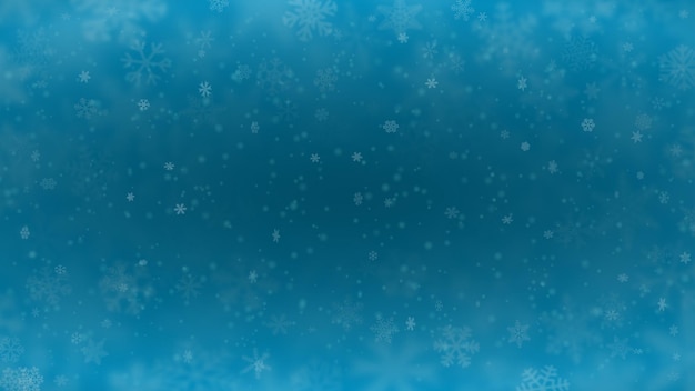 Kerstachtergrond van sneeuwvlokken van verschillende vormen, maten vervagen en transparantie in lichtblauwe kleuren