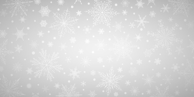 Kerstachtergrond van verschillende complexe grote en kleine sneeuwvlokken, in grijze kleuren