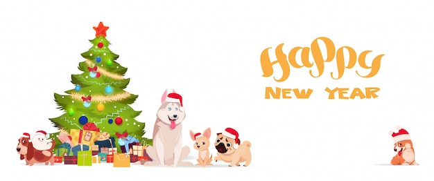 Kerstboom en schattige honden in santa hoeden op witte achtergrond gelukkig nieuwjaar banner vakantie gr