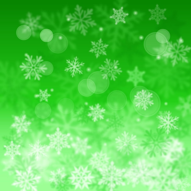 Kerstmis wazige achtergrond van complexe onscherpe grote en kleine vallende sneeuwvlokken in groene kleuren met bokeh-effect