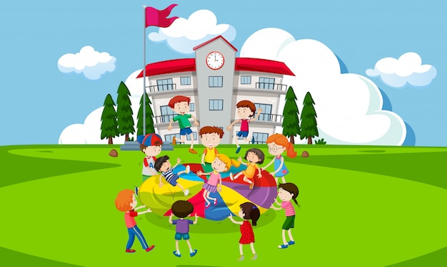 Kinderen die met een parachute voor school spelen