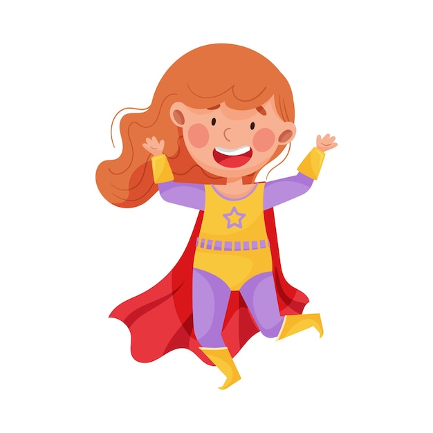 Kleine meisje met een superheldkostuum die met haar hand zwaait en springt.