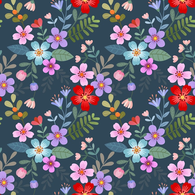 Kleurrijke bloeiende bloemen op blauwe kleur achtergrond naadloos patroon voor stoffen textiel behang