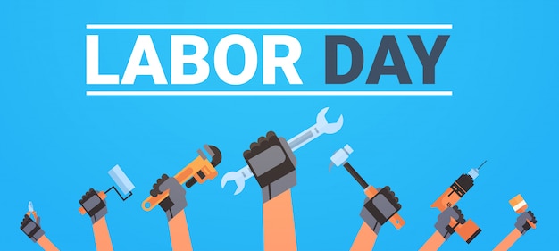 Labor day with hands holding different instruments workers holiday