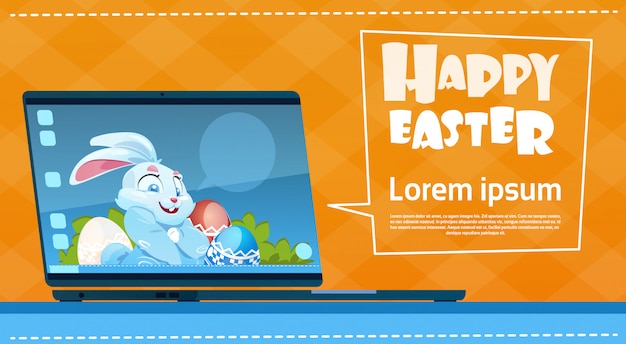 Laptop computer decorated colorful eggs rabbit easter holiday symbols greeting card