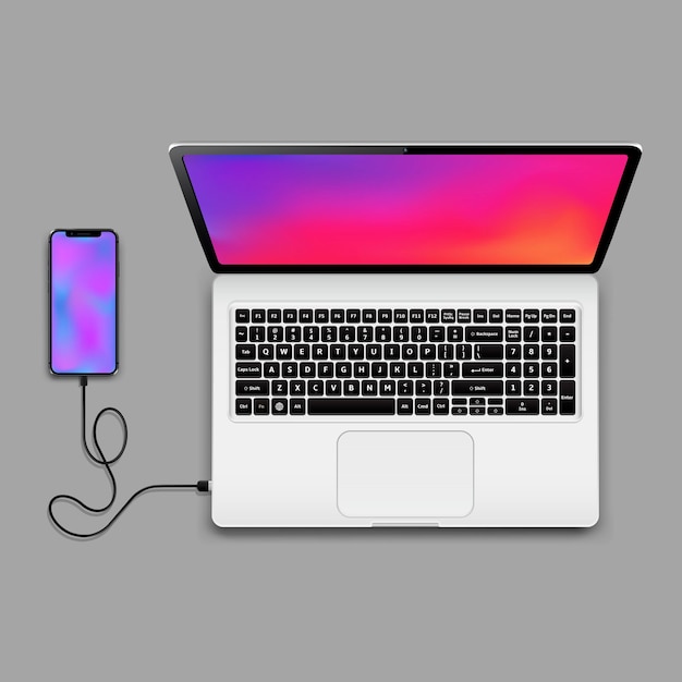 Laptop and connected smartphone with wallpaper screens