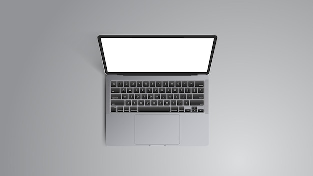 Ноутбук с белым экраном стоит на серой поверхности.