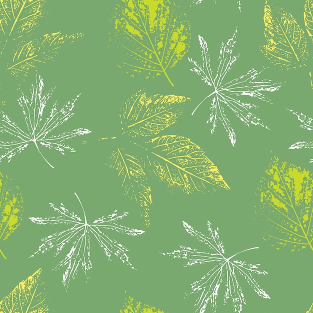 Leaf prints on a green background seamless pattern