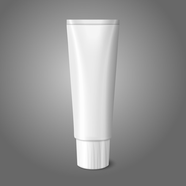 Lege witte realistische buis voor tandpasta, lotion, cosmetica, medicijncrème enz. op grijze achtergrond met plaats voor uw en branding.