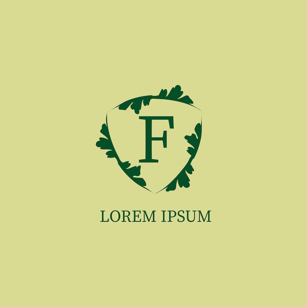 Letter F alphabetic logo design template isolated on green beige color Nature Guard Security logo concept Decorative floral shield sign illustration