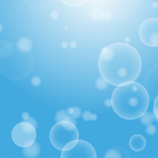 Light blue abstract background with a bokeh in the form of circles.