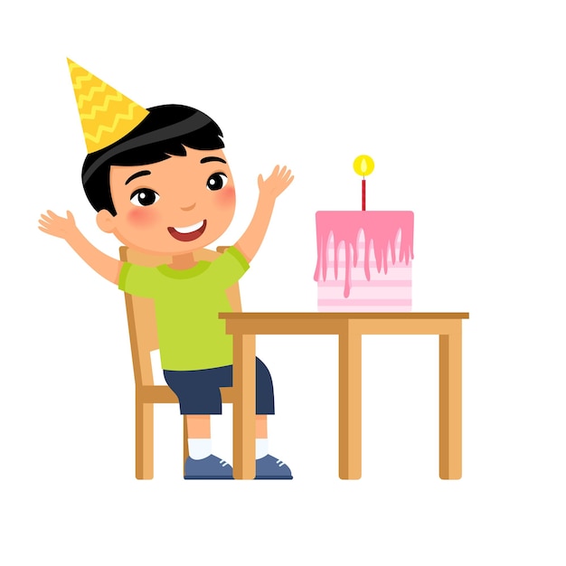 Piccolo ragazzo asiatico con torta di compleanno con candela sul tavolo