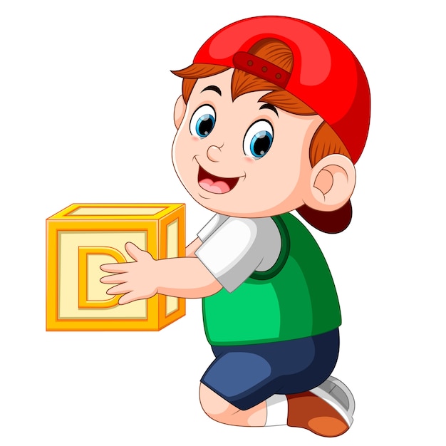 little boy holding the alphabet cube