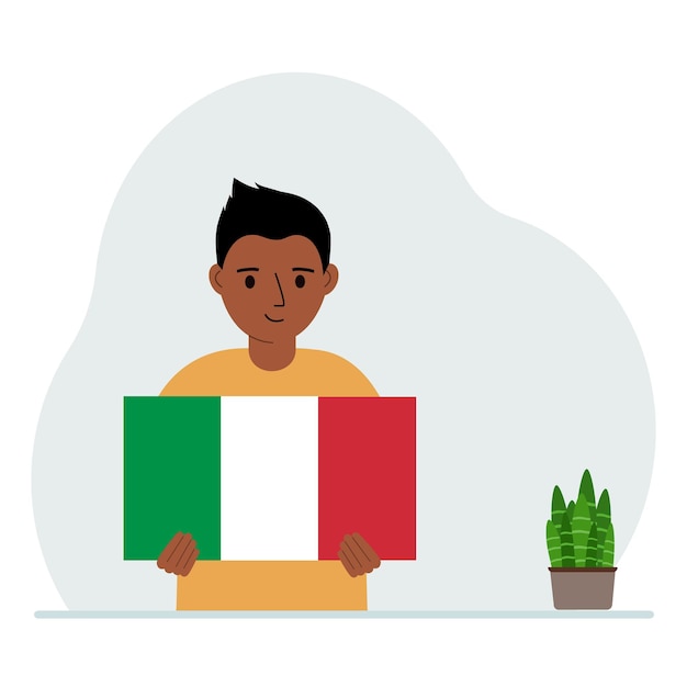 A little boy holds the flag of Italy in his hands The concept of demonstration national holiday or patriotism Nationality