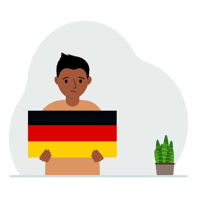 A little boy is holding the flag of germany in his hands the concept of demonstration national holiday or patriotism nationality