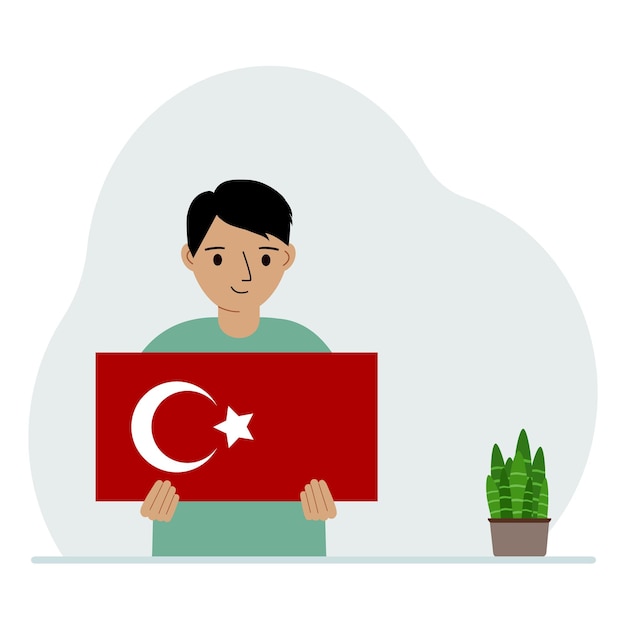 小さな男の子がトルコの国旗を手に持っているデモンストレーションの国民の祝日トルコの日または愛国心国籍のコンセプト