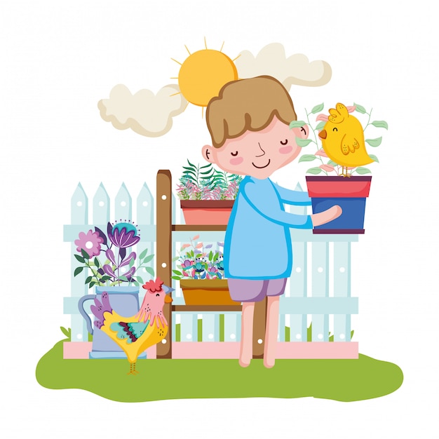 Little boy lifting houseplant with fence and chick