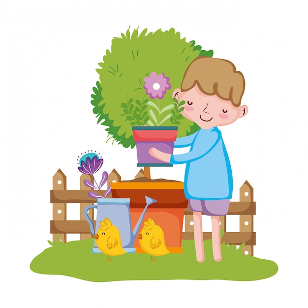 Little boy lifting houseplant with fence and chick