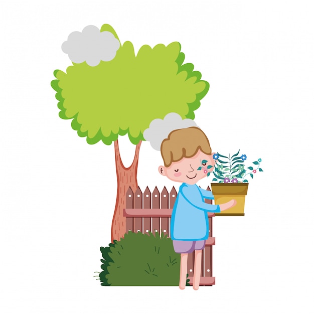 Little boy lifting houseplant with tree and fence