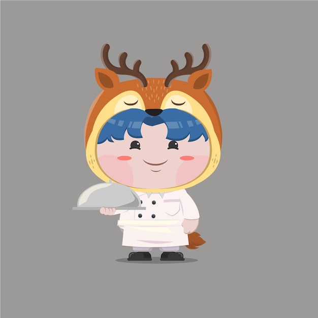 A little boy wearing chef deer costume