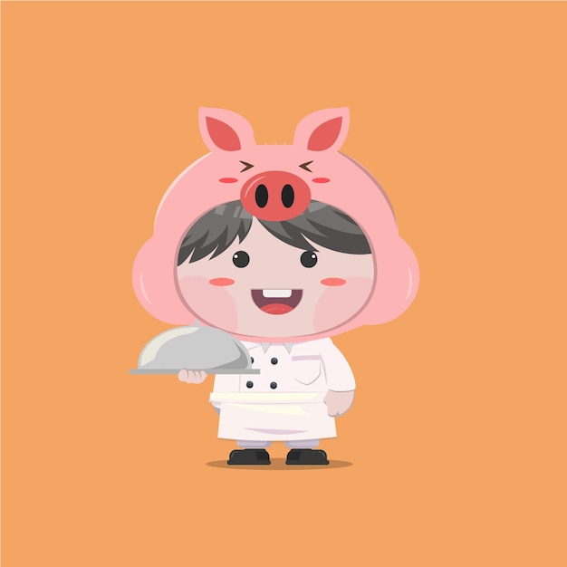 Un ragazzino che indossa un costume da maiale chef