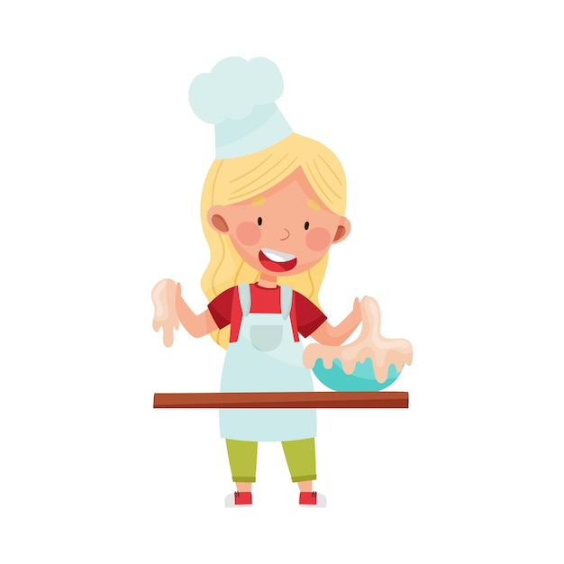 Little Girl Character in Hat and Apron Standing at Kitchen Table and Kneading Dough Vector Illustration