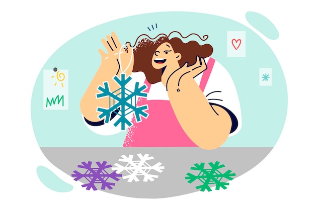 Vector little girl holding paper snowflakes to create christmas decorations for home with own hands