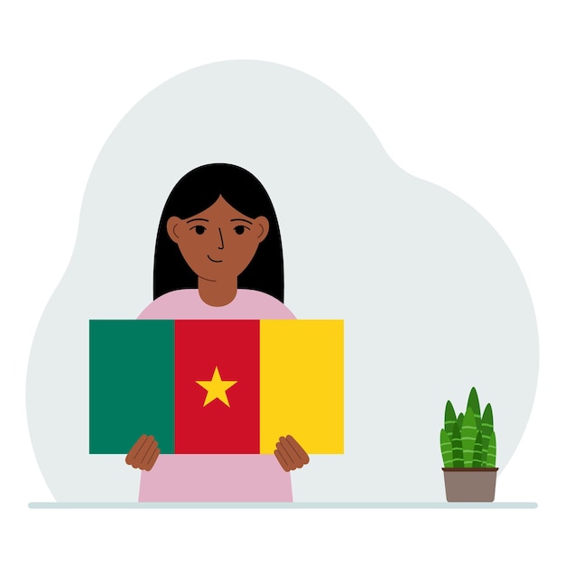 A little girl holds the flag of Cameroon in his hands The concept of demonstration national holiday or patriotism Nationality