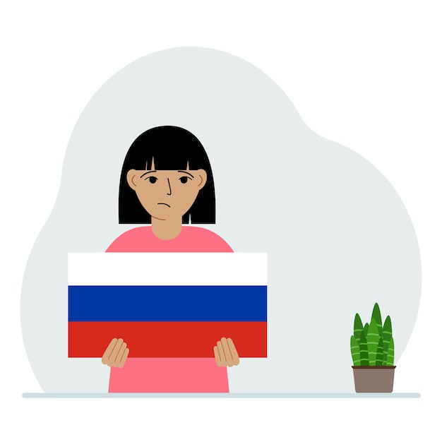 小さな女の子がロシアの国旗を持っているデモンストレーションの国民の祝日や愛国心のコンセプト