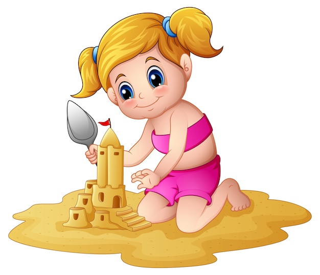 Bambina che fa sandcastle in spiaggia