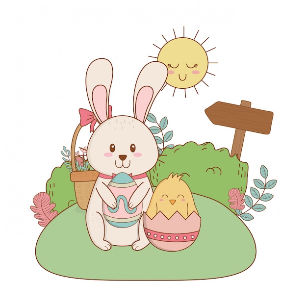 Little rabbit and chick with egg painted in the garden