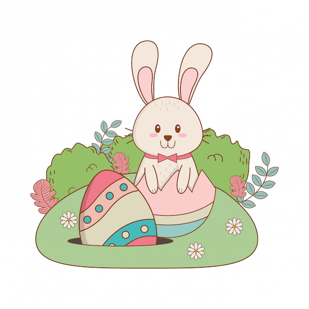 Little rabbit with egg painted in the garden