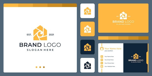 Logo that combines house shapes and camera and lens. business cards.