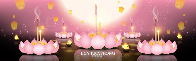 Celebrazione notturna del loy krathong festival con krathong realizzato con petali di loto rosa che galleggiano sul fiume
