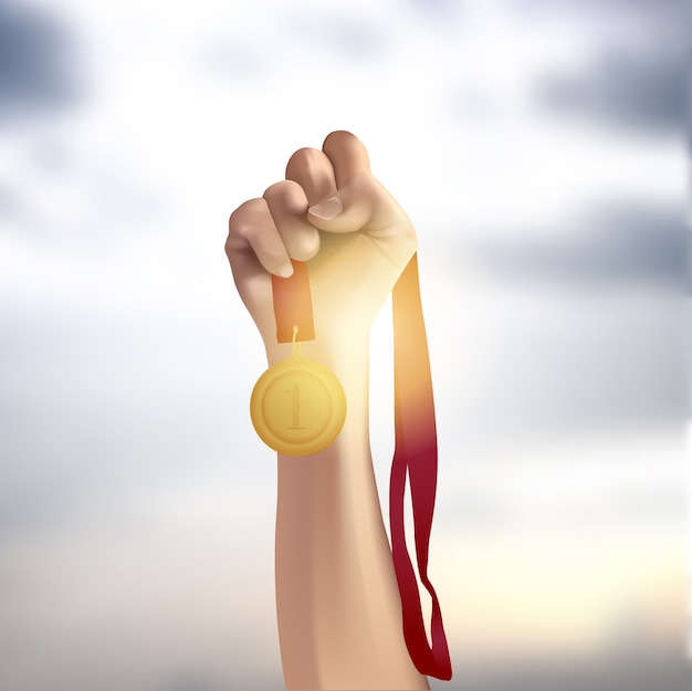 Male hand holding gold medal against the sky