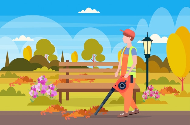 Male street cleaner holding leaves blower man in uniform cleaning service concept city urban park landscape background full length flat horizontal