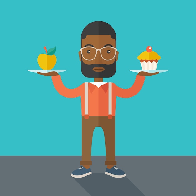 Man carries with his two hands cupcake and apple